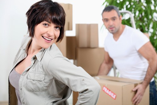 Packed moving boxes and furniture ready for small removals