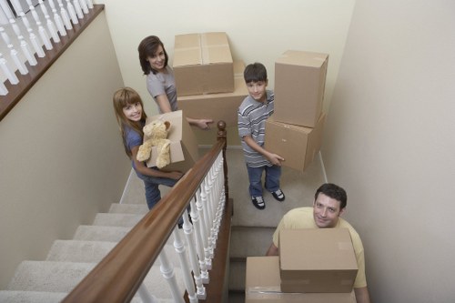 Loading furniture into a van for a small move in Woodgreen